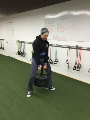 Emily doing a "duck walk" with 220lbs.